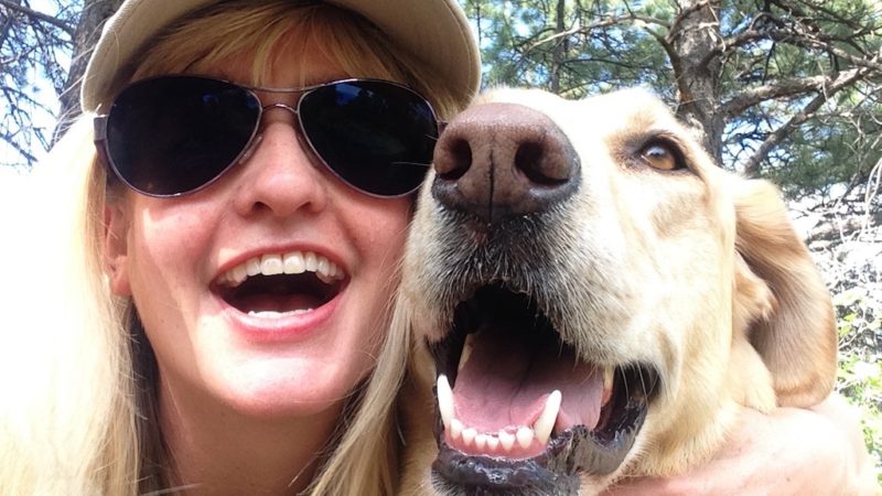 Woman playing with dog - 5 Ways Dogs Benefit from Volunteering Too! - PAW5